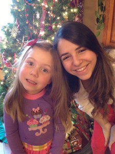 Beth-Rose and her big sister Ana share a joke on Christmas morning.