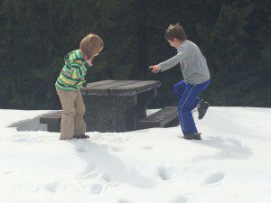 Family vacations-At a rest stop in the Rockies, we finally find some snow