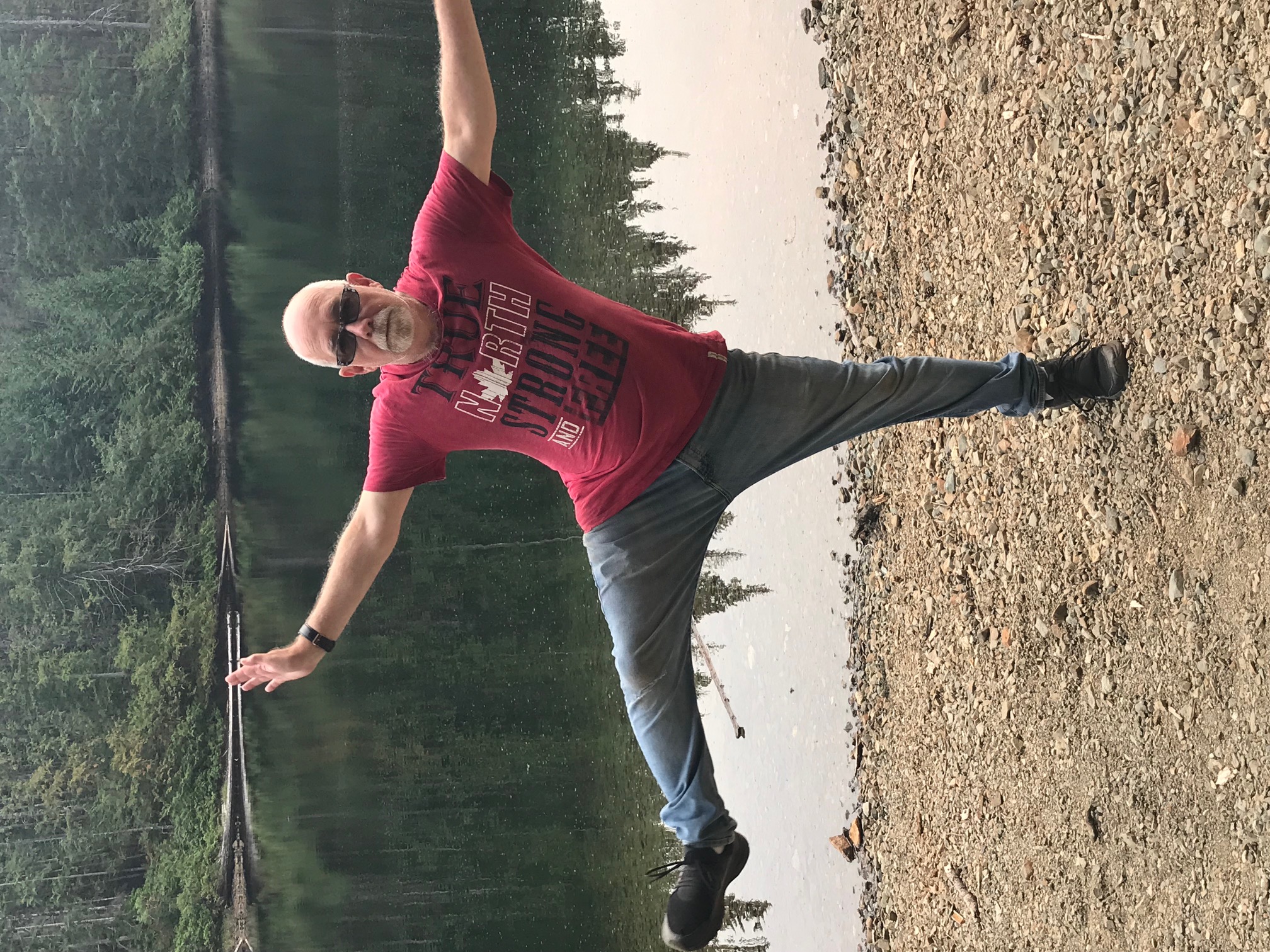 The author doing stretches by a lake