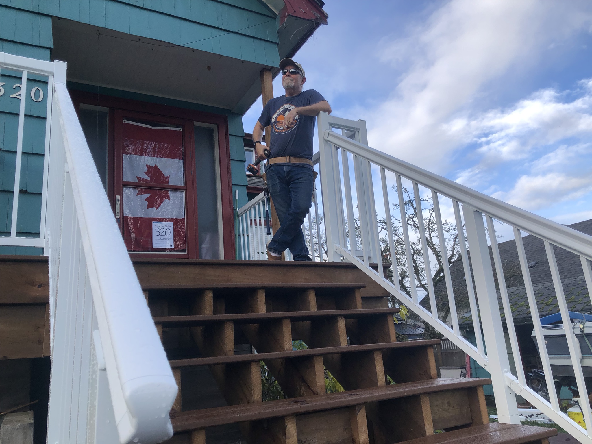 DIY porch building. The proud owner of a completed porch renovation