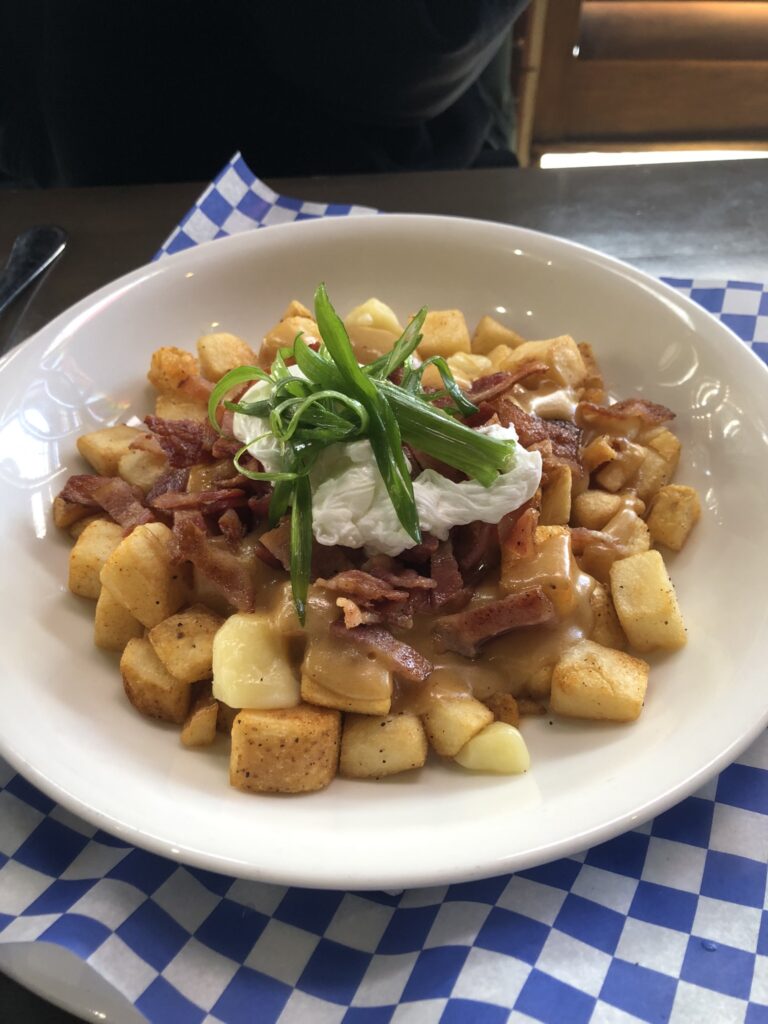traveling with your teen for a university audition-breakfast poutine from Palomino Smokehouse in Calgary